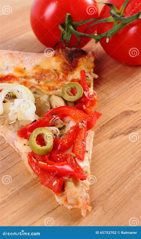 Slice Of Vegetarian Pizza And Tomatoes On Wooden Surface Stock Photo