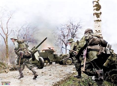 German Soldiers Of Kampfgruppe Hansen Rush Across A Road While Fighting