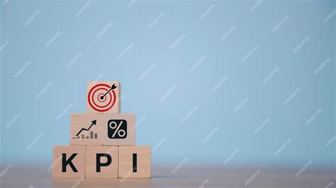 Premium Photo Wooden Cube With A Kpi Icon Business Goals Performance