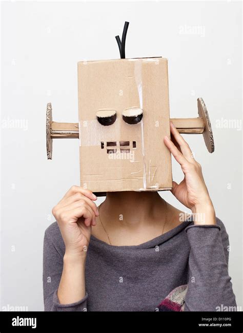 Robot Girl. Woman with a cardboard box on his head Stock Photo - Alamy