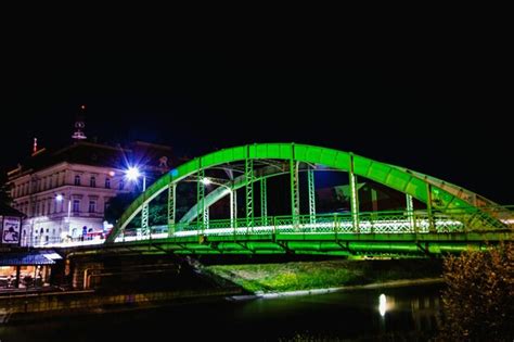 Premium Photo | View of bridge over river at night