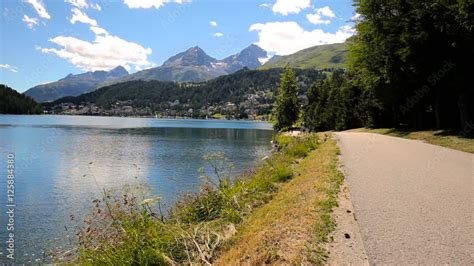 Walking Path Along Sankt Moritzersee With Green Forest And Swiss Alps