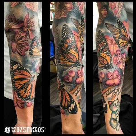 Incredible Full Sleeve Tattoo Featuring Monarch Butterflies And A