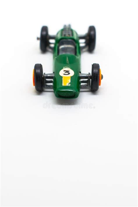 Miniature Green Race Car With Number 3 Isolated On A White Background