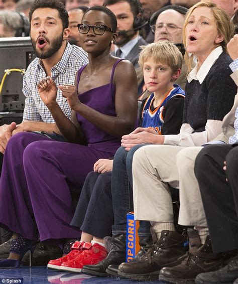 Lupita Nyongo Sits Courtside With Edie Falco And John Leguizamo At