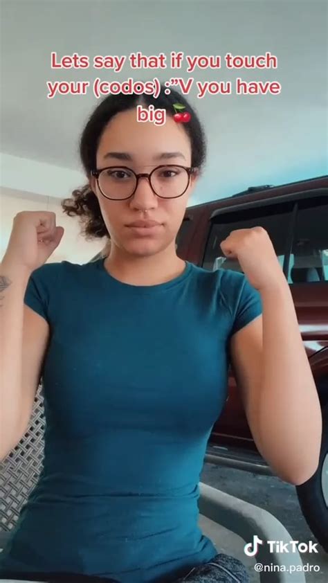 Tiktok User Ninapadro Squeezing Her Clothed Fully Covered Boobs Together With Her Arms Trying