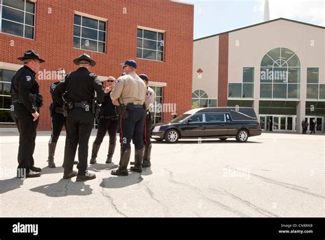 Agents Beside Hearse At Funeral For Police Officer Killed In The Line