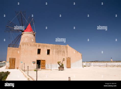 Windmill And Salt Marshes At Infersa Salt Pans Marsala Sicily Italy