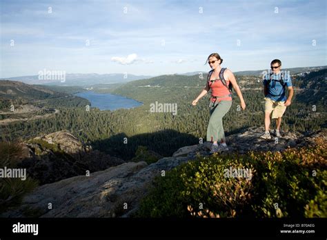 Young woman and man hiking near Donner Pass, CA Stock Photo - Alamy