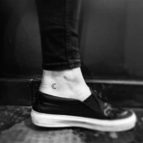 Minimalistic Style Crescent Moon Tattoo Located On The