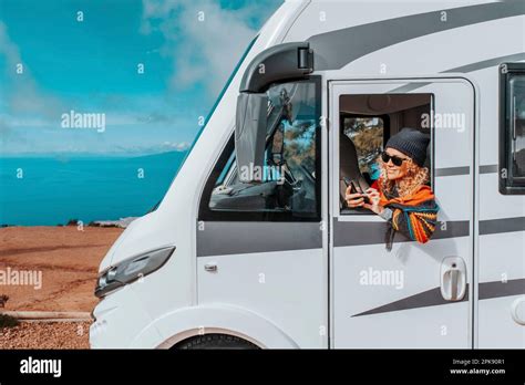 Camper Detail Woman Blonde Curls Cap Sunglasses Looking Out Stock Photo Alamy