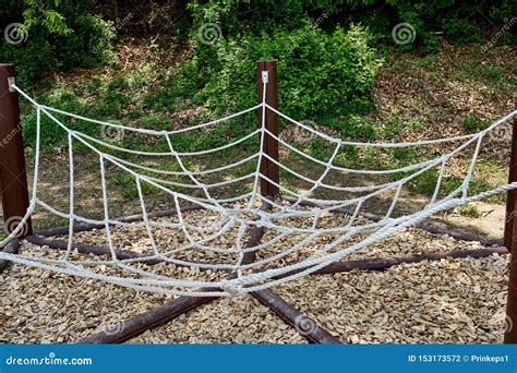 Decoration Shaped As A Spider Web Using Ropes Connected To Wooden Poles