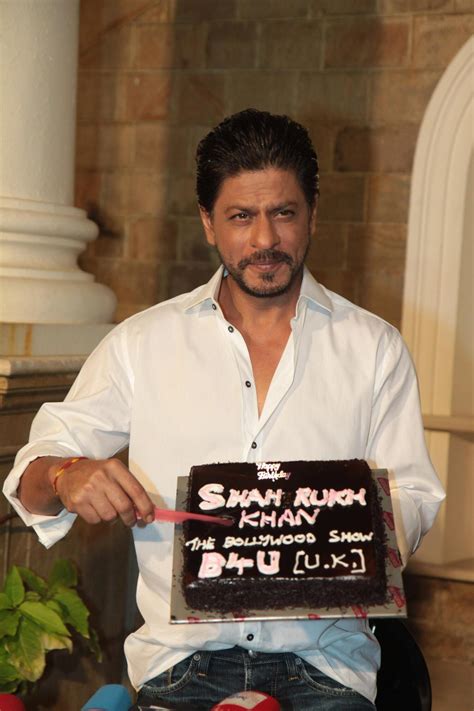 SRK cutting his 48th birthday cake at celebrations with the media at ...