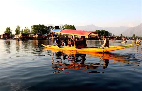 Tourists enjoy a Shikara ride on Dal Lake