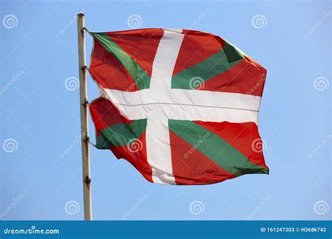 Euskadi Flag Waving Under a Blue Sky Background, Spain Stock Image ...