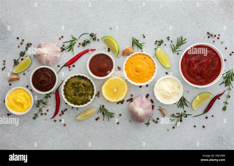 Different Types Of Sauces In Bowls With Seasonings Rosemary And Pepper