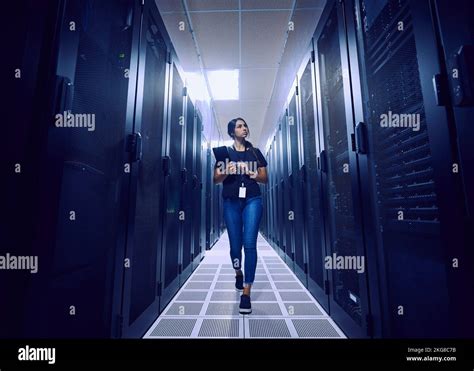 Female Technician Walking In Server Room Stock Photo Alamy