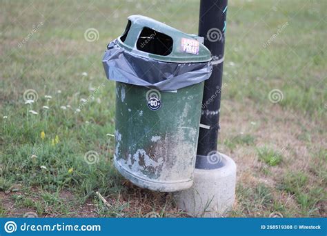 Dirty Green Trash Bin with Stickers on in a Park Stock Photo - Image of outdoor, garbage: 268519308