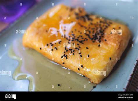 Fried Feta Cheese Wrapped In Phyllo Pastry With Honey And Sesame