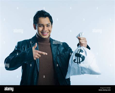 Portrait Of A Man Holding A Money Bag Stock Photo Alamy