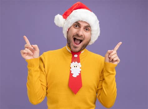 Free Photo Impressed Young Caucasian Man Wearing Christmas Hat And