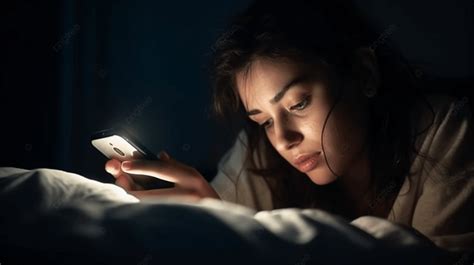 Girl Using Cell Phone By Bed At Night Background A Woman Lying Face