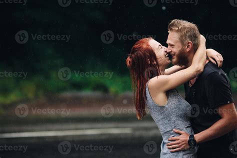 beautiful couple hugging in the rain 11531218 Stock Photo at Vecteezy