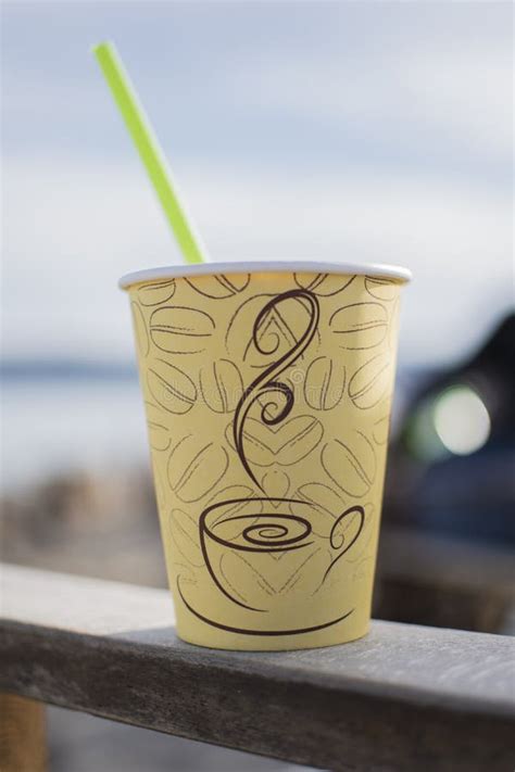 Straw And White Nescafe Frappe In A Paper Cup On The Beach Stock Image