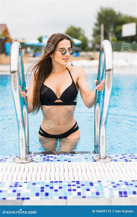 Beautiful Woman In Bikini Entering Swimming Pool Summer Time Stock