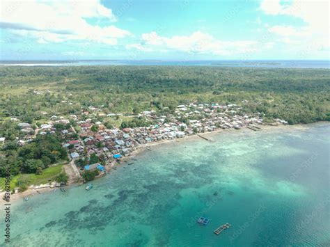 Aerial View Of Village Near Beautiful Beach With Small Island In The