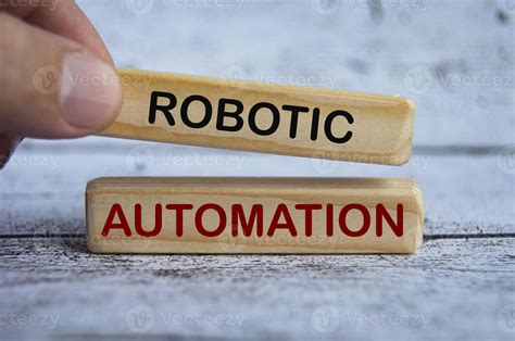 Hand Holding Wooden Blocks With Text Robotic Automation 9948143