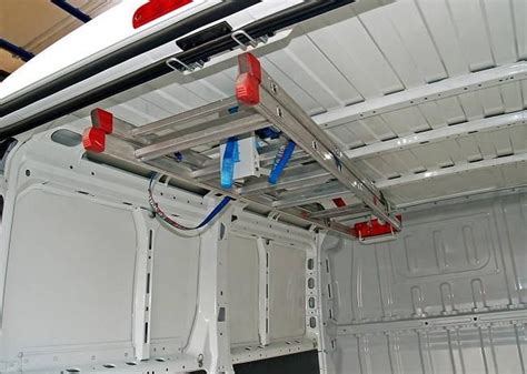 The Back End Of A White Van With Red And Blue Lights On Its Roof