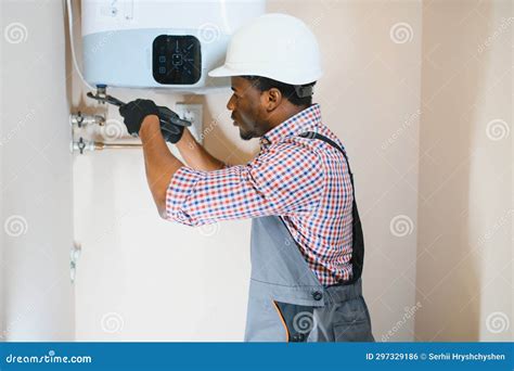 Professional Engineer Installing A Natural Gas Boiler At Home He Is