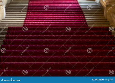 Red carpet on the stairs stock image. Image of honor - 296602641