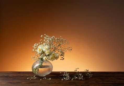 Premium Photo White Flowers In Glass Vase On Wooden Table