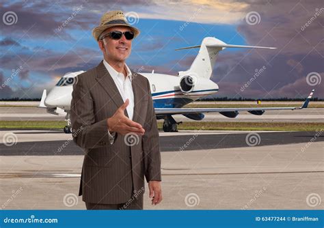 Elegant Man Welcoming At The Airport Next To A Jet Stock Photo Image