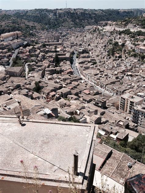 an aerial view of a city with lots of buildings