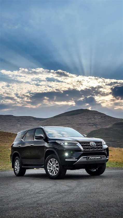 Fortuner Legender Mountains Background Black Car Hd Phone Wallpaper