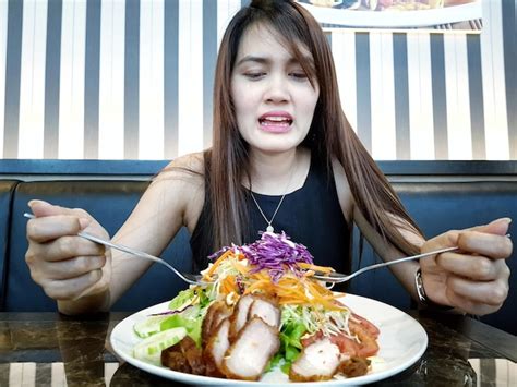 Premium Photo Woman Having Food While Sitting At Table