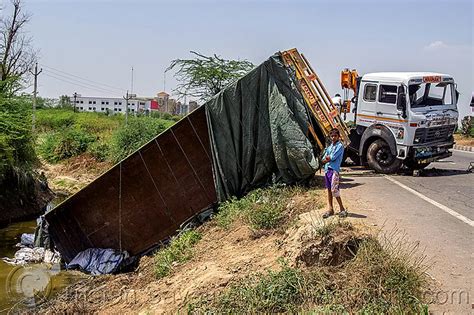 overturned semi truck, india