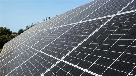 Rows of modern photovoltaic solar panels. Renewable ecological source of energy from the sun ...