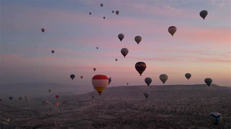 Hot air balloon flight in Goreme in Turkey during sunrise. Ride in a ...