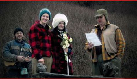 Three People Standing Next To Each Other Holding Flowers