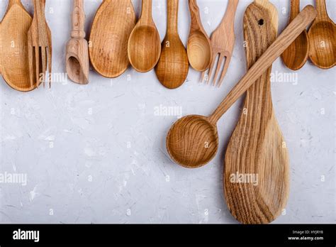 Frame Of Kitchen Wooden Utensils Spoons And Forks On Light Gray Color