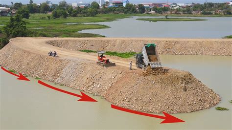 Incredible Dump Truck Distributing Stone Soil Using A Mini Bulldozer To