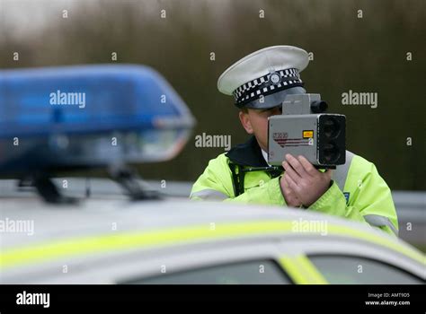 British Traffic Police Officer Monitors The Speed Of Road Traffic Stock