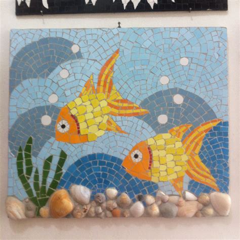 Two Gold Fish Swimming In The Ocean On A Mosaic Tile Wall Hanging Above