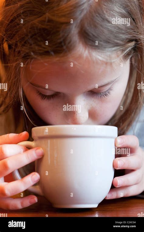 Caucasian Girl Drinking Hot Chocolate Stock Photo Alamy