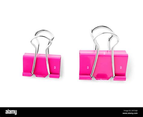 Pink binder clips isolated on white background Stock Photo - Alamy