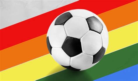 Premium Photo Soccer Ball And Rainbow Lgbt Flag On A Background